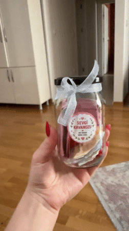 Woman displays decorative 'Love Jar' keepsake in Esenyurt, Turkey