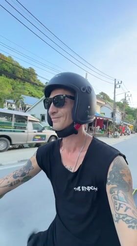 Riding through Karon's tropical streets on a sunny afternoon