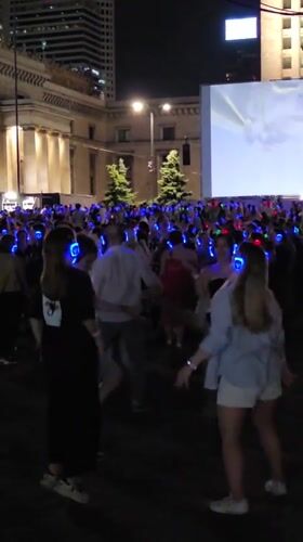 Silent disco lights up Warsaw's Museum of Technology plaza at night