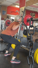 Woman performs morning workout at Saint Petersburg gym