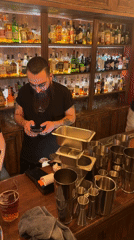 Bartenders work during evening service in Yerevan establishment