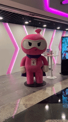 Pink cartoon mascot spotted in Sepang mall setting