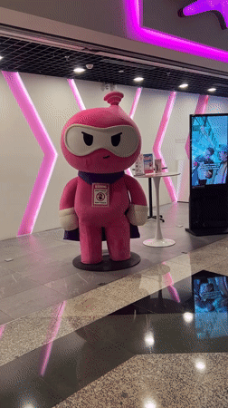 Pink cartoon mascot spotted in Sepang mall setting