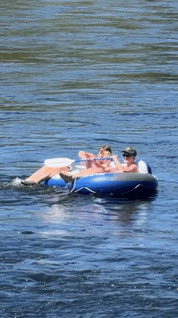 Tubing down a fast-moving river on a summer afternoon