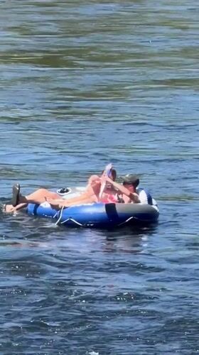 Tubing down a fast-moving river on a summer afternoon