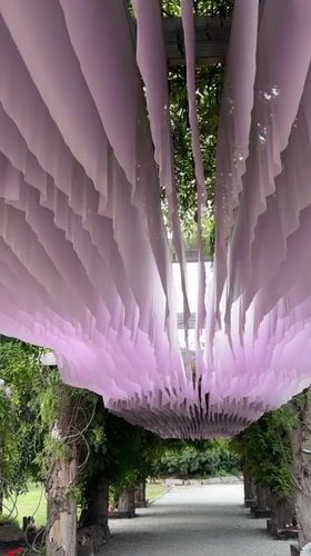 Ornamental garden space with fabric canopy and lion waterfall