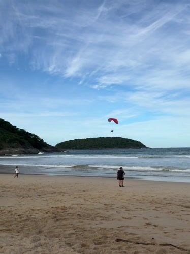 Late-night paragliding and beach activities documented in Rawai, Thailand