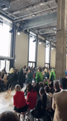 Fashion show features diverse models in Paris industrial venue