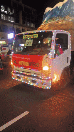 Nighttime civic parade rolls through La Paz with emergency services