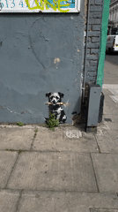Banksy-style dog with dynamite mural spotted in London