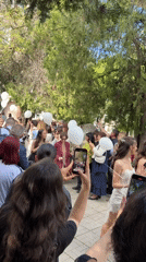 Crowd gathers with white balloons in Montana, Bulgaria