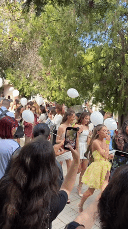 Crowd gathers with white balloons in Montana, Bulgaria