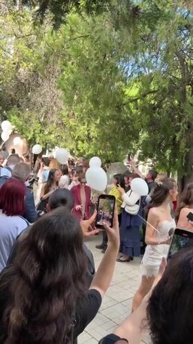 Crowd gathers with white balloons in Montana, Bulgaria