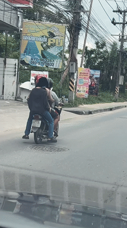 Motorcycle riders observed on overcast morning in Baan Bo Phut