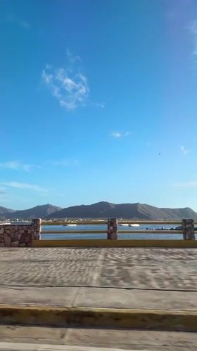 Late afternoon drive through Juan Griego's palm-lined coastal streets