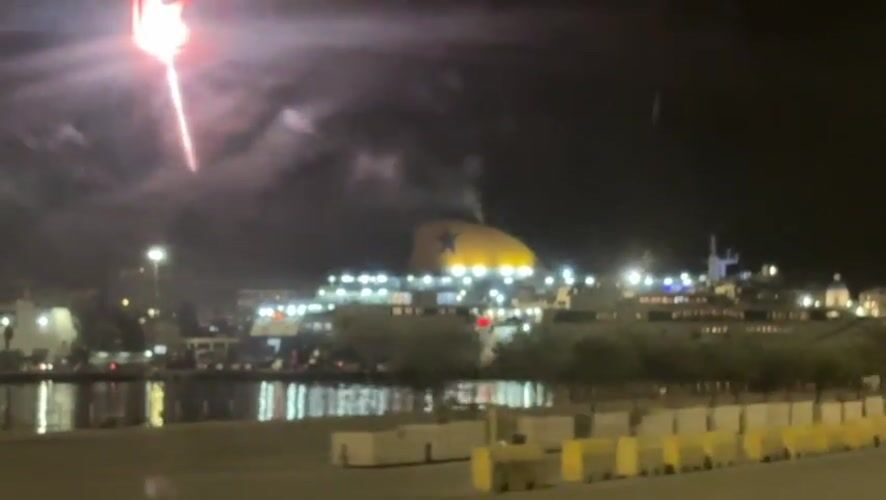 Nighttime ferry operations documented at Piraeus harbor Greece