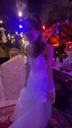Bride dances at wedding celebration in Thailand