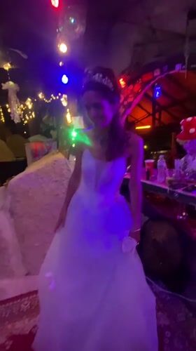 Bride dances at wedding celebration in Thailand