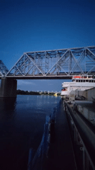 Dusk along the Shebunino riverfront, bridges and golden domes