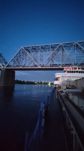 Dusk along the Shebunino riverfront, bridges and golden domes