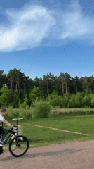 Woman poses for photos in sunny Moscow park