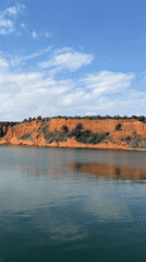 Red cliff formation documented along Greek waterway