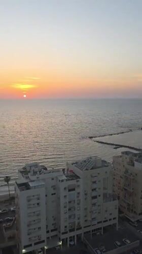 Mediterranean sunset captured from high-rise in Bat Yam, Israel