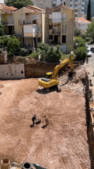 Excavator demolishes hillside at Montenegro construction site