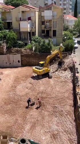 Excavator demolishes hillside at Montenegro construction site