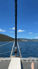 Catamaran spotted off Montenegro coast in peaceful daytime scene