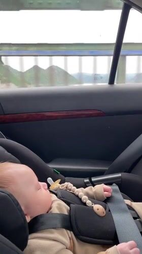 Baby sleeps during car journey across Montenegro bridge