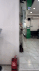 Person takes mirror selfie in Abakan office building