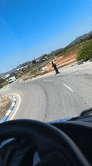 Driver encounters scooter rider at Montcada traffic circle