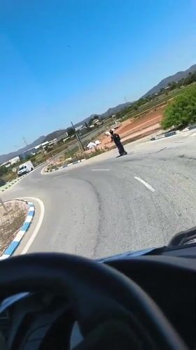 Driver encounters scooter rider at Montcada traffic circle