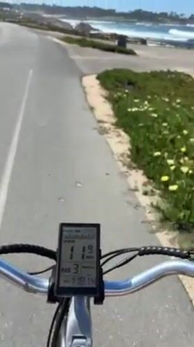 E-bike rider cruises coastal path in Del Monte Forest