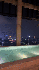 Nighttime rooftop pool scenes captured in Central Jakarta
