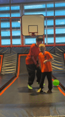 Boys play at trampoline park near LeBron James mural