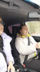 Two women drive through Chaikovsky, passenger singing
