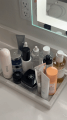 Skincare products organized on bathroom counter in Los Angeles