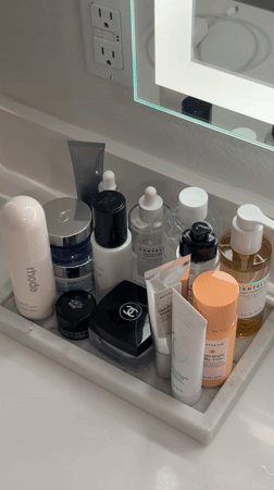 Skincare products organized on bathroom counter in Los Angeles
