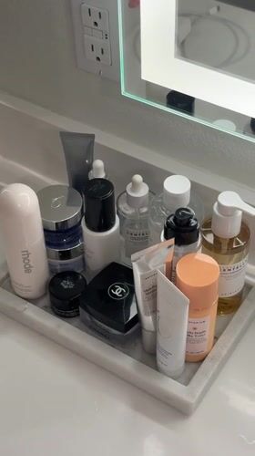 Skincare products organized on bathroom counter in Los Angeles