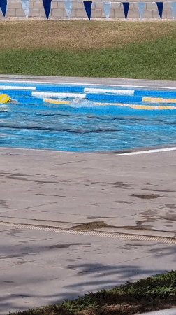 Summer morning at an outdoor pool in Sant Joan Les Fonts