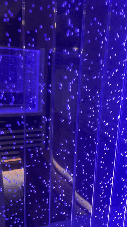 Blue-lit bubble wall display captured in Belarus village