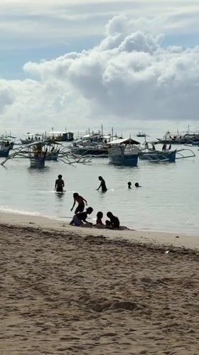 Evening beach life documented in General Luna, Philippines