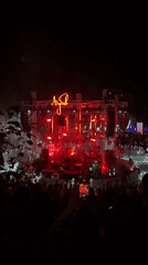 Red-lit DJ stage at a Belgrade outdoor night festival