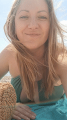 Woman enjoys sunny beach day in Budva, Montenegro