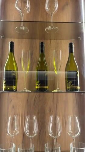 Evening home scene captured in Plovdiv featuring wine display