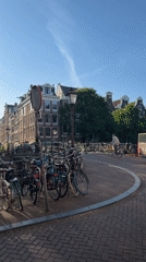 Morning scenes document typical Amsterdam street life and infrastructure