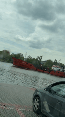 Ferry crosses waters near Beloslav, Bulgaria with vehicle passengers