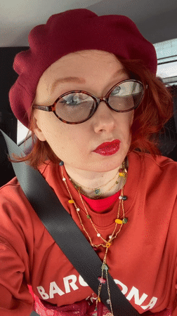 Cheerful red-haired woman in beret spotted in Yekaterinburg vehicle